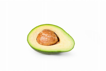 Half an avocado sliced open to reveal the pit Stock Photo - Budget Royalty-Free & Subscription, Code: 400-04665170