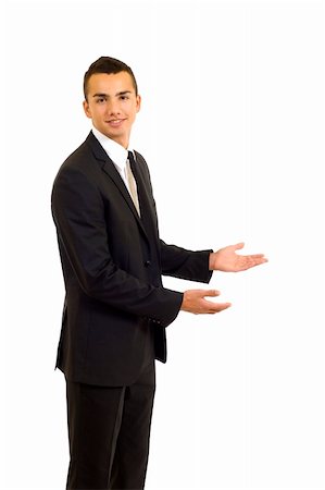 executive welcome - Male Model wearing a suit pointing to a white background Stock Photo - Budget Royalty-Free & Subscription, Code: 400-04665385