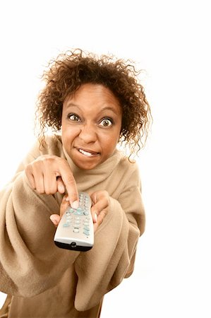 Woman holding TV remote wearing blanket with sleeves Foto de stock - Super Valor sin royalties y Suscripción, Código: 400-04665637