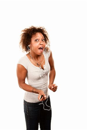 earbuds jeans - Pretty African American Woman Dancing with Personal Listening Device Stock Photo - Budget Royalty-Free & Subscription, Code: 400-04665646