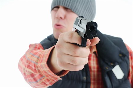 simsearch:400-04577380,k - Young man is aiming with gun. Isolated on white. Fotografie stock - Microstock e Abbonamento, Codice: 400-04665775