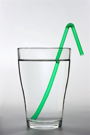 simsearch:400-05291556,k - close up shot of a full water glass with a green drinking straw Stock Photo - Budget Royalty-Free & Subscription, Code: 400-04666020