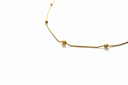 simsearch:400-04778993,k - Golden necklace isolated on white background. Stock Photo - Budget Royalty-Free & Subscription, Code: 400-04666079