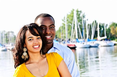 Portrait of young romantic couple standing at harbor Stock Photo - Budget Royalty-Free & Subscription, Code: 400-04666426