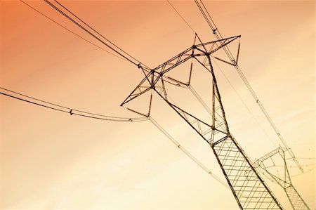 energy infrastructure - high voltage pylons at sunset. Copy space Stock Photo - Budget Royalty-Free & Subscription, Code: 400-04666554