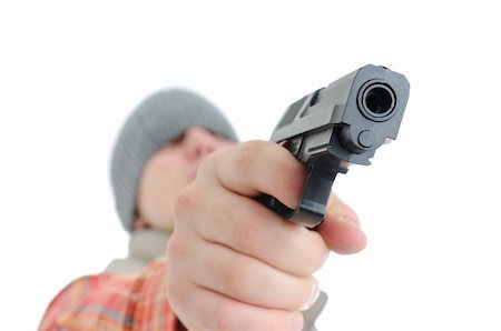 simsearch:400-04577380,k - Young man is aiming with gun. Isolated on white. Fotografie stock - Microstock e Abbonamento, Codice: 400-04666866