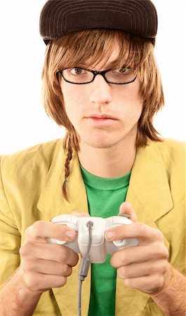 Teenage boy in glasses holding electronic game controller Stock Photo - Budget Royalty-Free & Subscription, Code: 400-04666968