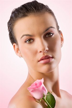 simsearch:400-06096871,k - close up portrait of a pretty brunette with a pink rose Stock Photo - Budget Royalty-Free & Subscription, Code: 400-04667005