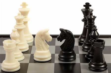 chessmen on a chessboard Stock Photo - Budget Royalty-Free & Subscription, Code: 400-04667051