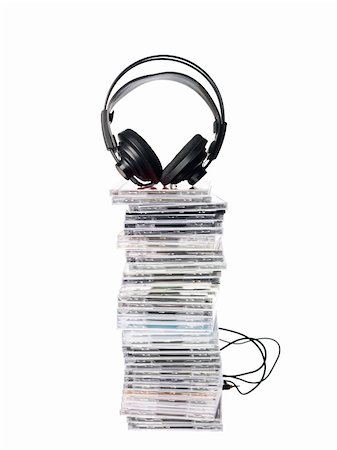 Stack of Cd`s and Headphones isolated on white background Stock Photo - Budget Royalty-Free & Subscription, Code: 400-04667203