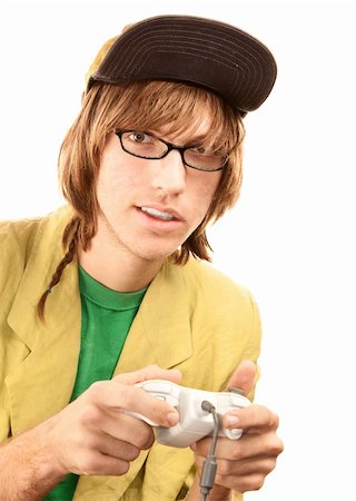 Teenage boy in glasses holding electronic game controller Stock Photo - Budget Royalty-Free & Subscription, Code: 400-04667336