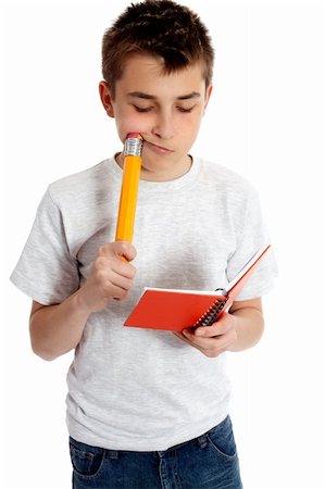 peur de la feuille blanche - A child with a snall notebook and a large pencil Photographie de stock - Aubaine LD & Abonnement, Code: 400-04667503