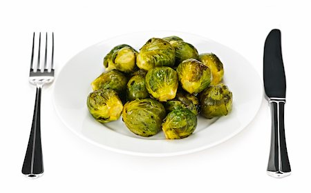 simsearch:400-06429494,k - Plate of roasted green brussels sprouts with knife and fork isolated on white Stock Photo - Budget Royalty-Free & Subscription, Code: 400-04667866