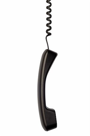 simsearch:400-07038627,k - A business telephone receiver hangs by its cord on the white background. Fotografie stock - Microstock e Abbonamento, Codice: 400-04668015