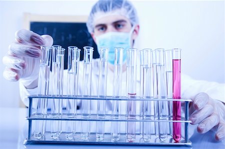 Scientist in laboratory examinates samples and chemical fluids. Stock Photo - Budget Royalty-Free & Subscription, Code: 400-04668038