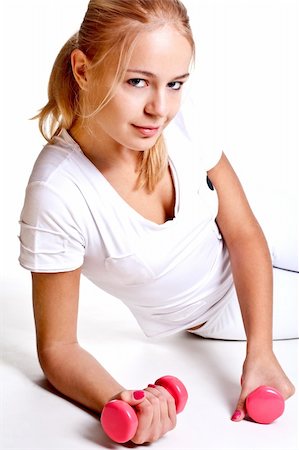 simsearch:400-06083451,k - pink dumbbells in the hands of women on a white background Photographie de stock - Aubaine LD & Abonnement, Code: 400-04668196