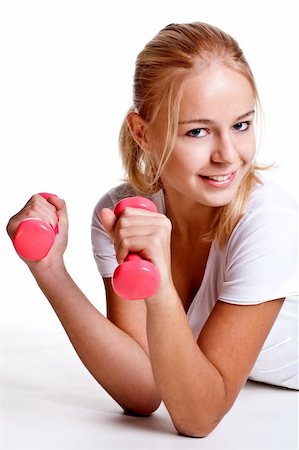 simsearch:400-06083451,k - pink dumbbells in the hands of women on a white background Photographie de stock - Aubaine LD & Abonnement, Code: 400-04668197