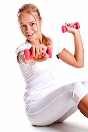 simsearch:400-06083451,k - pink dumbbells in the hands of women on a white background Photographie de stock - Aubaine LD & Abonnement, Code: 400-04668190