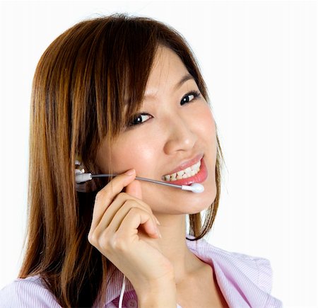simsearch:400-04801703,k - Friendly Customer Representative with headset smiling during a telephone conversation. Foto de stock - Super Valor sin royalties y Suscripción, Código: 400-04668597