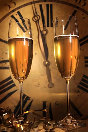 simsearch:400-05082002,k - Glasses of Champagne ready to bring in the New Year Photographie de stock - Aubaine LD & Abonnement, Code: 400-04669130