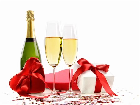 simsearch:400-05027600,k - Glasses of champagne with bottle and gifts on white Stock Photo - Budget Royalty-Free & Subscription, Code: 400-04669143