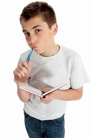 peur de la feuille blanche - Student holding a book, pen and thinking intently. Photographie de stock - Aubaine LD & Abonnement, Code: 400-04669297
