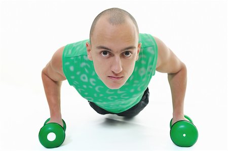 simsearch:400-06141339,k - strong young man exercise fitness isolated on white Stockbilder - Microstock & Abonnement, Bildnummer: 400-04669624