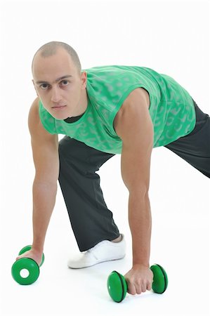 simsearch:400-06099676,k - strong young man exercise fitness isolated on white Foto de stock - Super Valor sin royalties y Suscripción, Código: 400-04669623