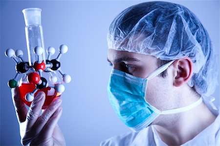 Scientist in laboratory examinates samples and chemical fluids. Stock Photo - Budget Royalty-Free & Subscription, Code: 400-04669957