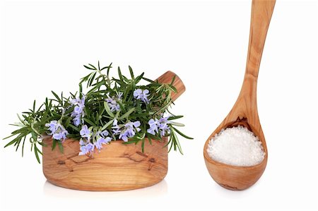 simsearch:400-04348087,k - Rosemary herb in flower with leaves  in olive wood mortar with pestle,  with sea salt in a wooden ladle, over white background with reflection. Stock Photo - Budget Royalty-Free & Subscription, Code: 400-04660137