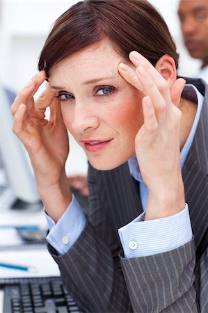 simsearch:6108-06167843,k - Young businesswoman having a headache in the office Stockbilder - Microstock & Abonnement, Bildnummer: 400-04660419