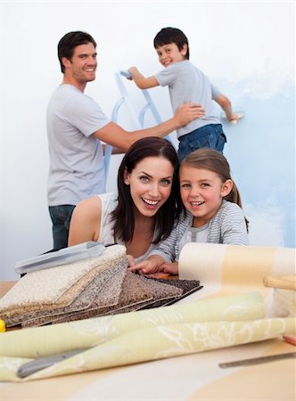 simsearch:400-04878558,k - Portrait of a smiling family doing up their new home Stock Photo - Budget Royalty-Free & Subscription, Code: 400-04660461