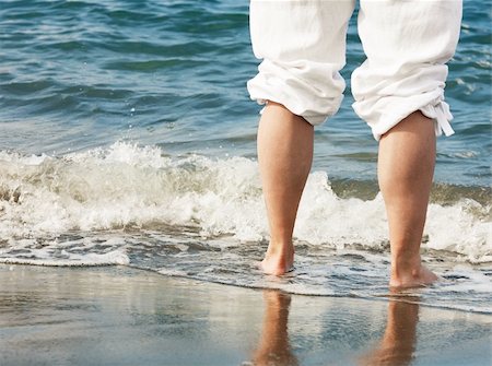 simsearch:400-04912125,k - Barefoot male legs in ocean on the shoreline Stock Photo - Budget Royalty-Free & Subscription, Code: 400-04660602