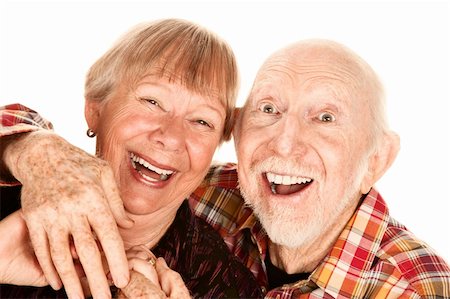 simsearch:400-04744719,k - Happy senior couple on white background laughing broadly Stock Photo - Budget Royalty-Free & Subscription, Code: 400-04660629