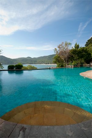 a view to the sea from a luxurious pool Stockbilder - Microstock & Abonnement, Bildnummer: 400-04661018