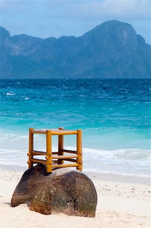 Wooden chair on the beach over a stub Stockbilder - Microstock & Abonnement, Bildnummer: 400-04661051