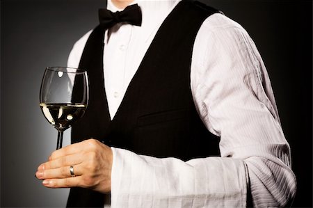 professional waiter in uniform is serving wine Stock Photo - Budget Royalty-Free & Subscription, Code: 400-04661104