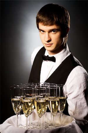 professional waiter in uniform is serving wine Stock Photo - Budget Royalty-Free & Subscription, Code: 400-04661100