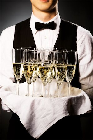 professional waiter in uniform is serving wine Stock Photo - Budget Royalty-Free & Subscription, Code: 400-04661102