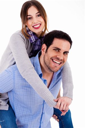 Cheerful young couple piggybacking on a white background Stock Photo - Budget Royalty-Free & Subscription, Code: 400-04661190