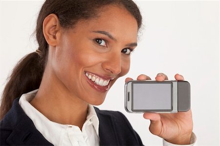 edbockstock (artist) - Closeup of young businesswoman holding mobile device. Horizontally framed shot. Photographie de stock - Aubaine LD & Abonnement, Code: 400-04661644