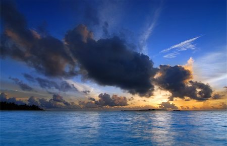 Beautiful colorful sunset over the ocean in the Maldives seen from the beach - HDR Stock Photo - Budget Royalty-Free & Subscription, Code: 400-04661720