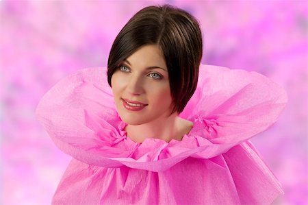 simsearch:400-06639774,k - young and cute brunette in an original pink collar dress made of paper looking sweet Stock Photo - Budget Royalty-Free & Subscription, Code: 400-04661738