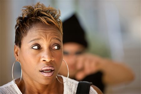 African-American woman being stalked by a criminal Stock Photo - Budget Royalty-Free & Subscription, Code: 400-04661838