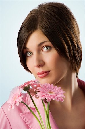 simsearch:400-04667271,k - nice shot of a cute young woman with pink flowers looking in camera Stock Photo - Budget Royalty-Free & Subscription, Code: 400-04662577