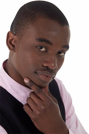 simsearch:400-04662774,k - Young Adult black african businessman wearing a dark smart-casual outfit without a Jacket, but with a pink shirt and a dark waistcoat on a white background in various poses with various facial expressions. Part of a series, Not Isolated. Foto de stock - Royalty-Free Super Valor e Assinatura, Número: 400-04662769