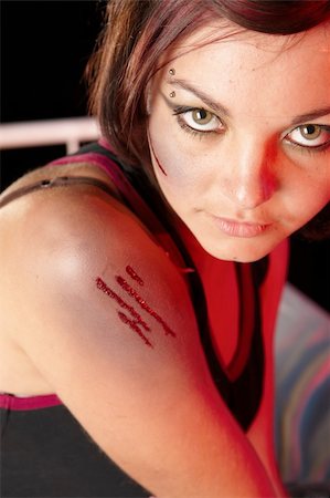 Single female modern dancer with scar on her face during dance training session on stage. Lit with spotlights Stock Photo - Budget Royalty-Free & Subscription, Code: 400-04662910