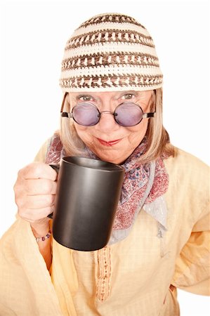 Crazy new age woman in a yellow robe smiling with coffee cup Stock Photo - Budget Royalty-Free & Subscription, Code: 400-04663015