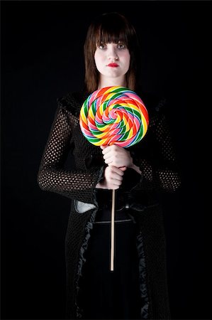 Pretty emo girl with bright colorful lollipop Stock Photo - Budget Royalty-Free & Subscription, Code: 400-04663017