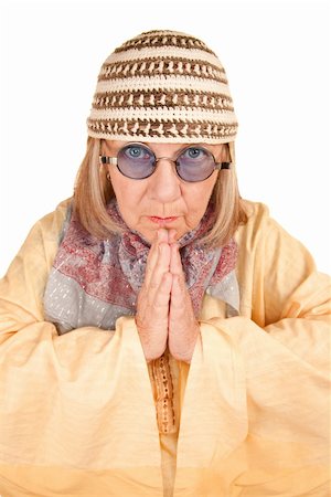 Crazy new age woman with hands together in a yellow robe Stock Photo - Budget Royalty-Free & Subscription, Code: 400-04663012